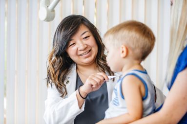 University of California Health medical care provider takes child's temperature. UCH Children's Hospitals ranked among the best in the nation for 2021-22 by US News & World Report.