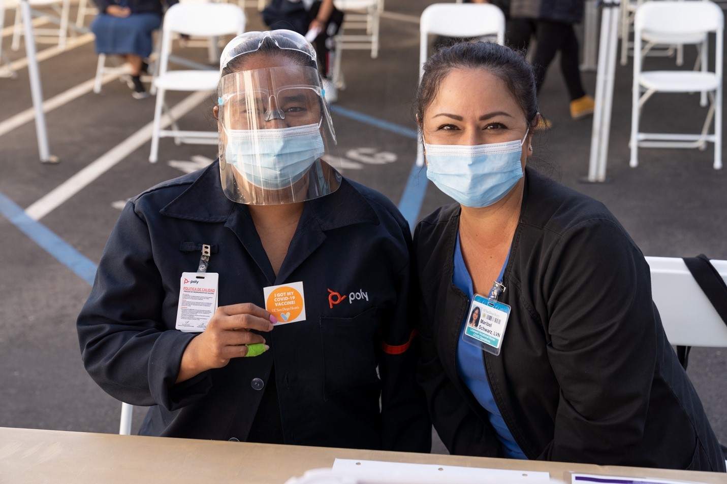 Two UC San Diego Health staff pictured at a COVID-19 vaccination site. UC San Diego Health staff vaccinated thousands of maquiladoras, employees of US companies operating in Mexico, via a mobile clinic at the San Ysidro border in an effort to protect employees and help accelerate the economy’s recovery from the pandemic. 
