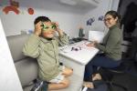 child receiving glasses at UCI Heatlh's Eye Mobile Van