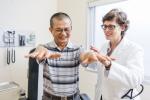 a physician caring for an elderly man 