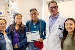 Doctor with patient and family