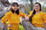 Annabelle (left) with mom (right) standing between tree branches