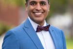 Ashish Atreja wearing a blue jacket and bow tie