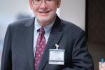 Dr. Bradley Pollock leaning against counter
