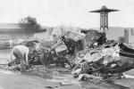 black and white of wrecked plane outside ice cream shop