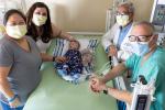 Gary Raff, Frank Ing with patient Carter Vincent and his parents Elizabeth and Christine 