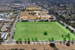 Aerial photo showing tract of grassy land at intersection of Laguna Springs Drive and Elk Grove Boulevard