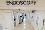 Hospital hallway with Endoscopy written above doorway