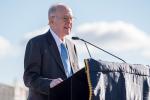 Gordon Moore stands at podium speaking into the microphone