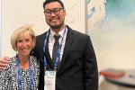 Margie Junker and Dr. Khong standing arm in arm smiling