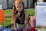 Kaileia Boudinot set up shop in front of her Elk Grove home. Her brother, Brian, was her assistant.