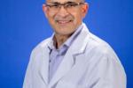 Bob Kiaii sitting and wearing a white lab coat