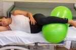 Woman in labor with peanut ball