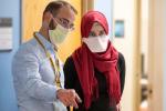 Dr. Martin standing next to Khadija Soufi pointing at something