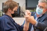 doctor with glasses and patient, both with masks