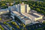Large building with Sacramento city skyline in the distance