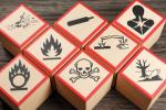 Wooden blocks show symbols for types of chemicals and other hazards.