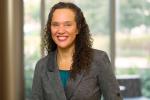 Piri Ackerman-Barger standing in front of window smiling