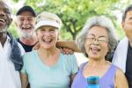 A group of senior adults stand together after exercising