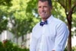 Dr. Lor Randall smiling and wearing a bow tie