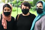 Students Sasha Afroz, Niloofar Jannesar and Maha Kazmi on the sidewalk before visiting the home of a refugee family