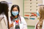DNP Chris de Belen-Wilson, center, talks with two nurse practitioner students