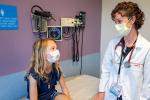 Scarlett Hershey in a checkup appointment with pediatric endocrinologist Stephanie Crossen.
