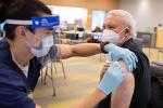 Sergio Aguilar-Gaxiola receiving a COVID vaccine