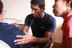Male doctor helping female patients in the Philippines