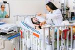 Nurse with pediatric patient speaking with doctor