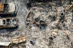 Overhead view of cars and structures burned by the Eaton Fire in Altadena, Calif.