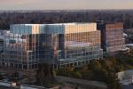 A large glass and metal building on the UC Davis Health campus