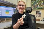 At her UC Davis office, Kristen Aiemjoy holds the filter paper her team uses to collect blood and test scrub typhus antibodies.
