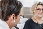woman having her heart listened to