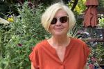 Barbara Tiney wearing sunglasses and standing in a garden. 