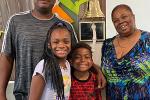 10-year-old African American boy, his 11-year-old sister, their dad and their grandmother