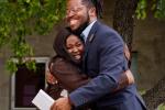 Student and staff mentor hugging
