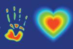 Thermal-style image of a handprint and a glowing heart on a blue background.