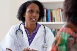 Female doctor listening to a female patient