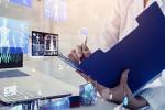 Medical person completing chart during a video visit