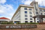 Exterior of building with a sign that reads “Enloe Health”