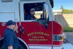 Richard Gerety returns home from the hospital via fire truck. 