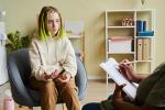 Teenage girl talking to a school counselor