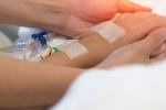 Tight shot of hands and IV