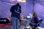 Person receives EKG in medical tent