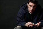 Serious young man with prescription medication