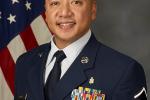 MSgt Salinas in U.S. Air Force uniform, American flag in background