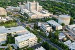 Aerial view of the UC Davis Medical Center campus with downtown Sacramento skyline in the distance