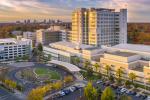Aerial view of UC Davis Medical Center during the day with the skyline of Sacramento in the distance.