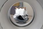 Patient undergoing a CT scan laying down